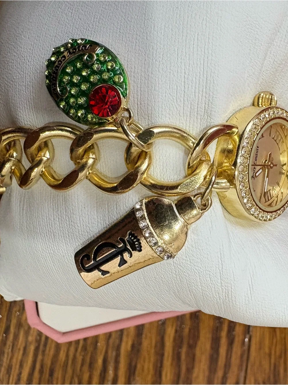 Juicy Couture Gold Tone Charm Bracelet Watch with Green and Red Accent